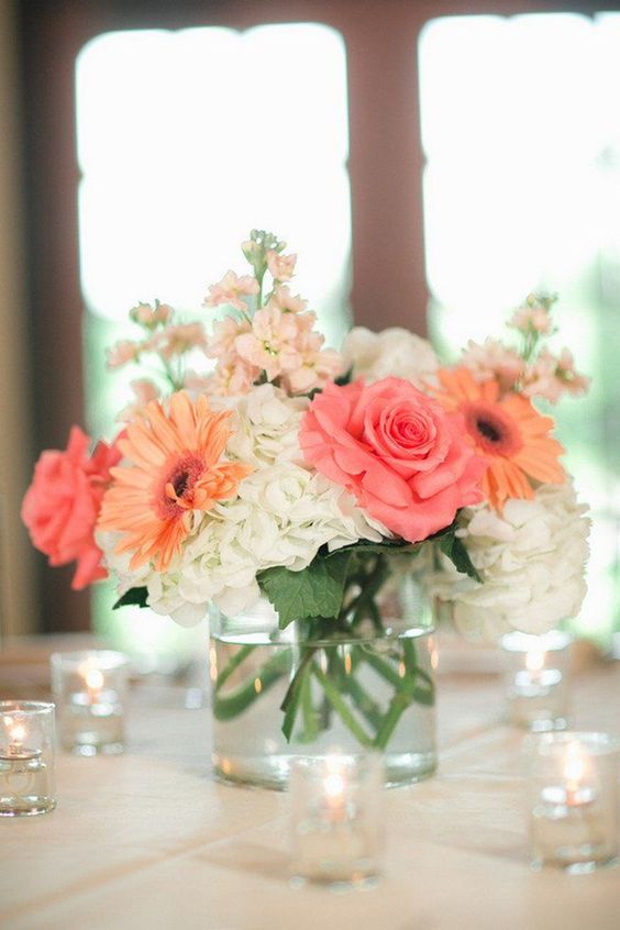 simply elegant coral wedding centerpieces with hydrangea and roses: 