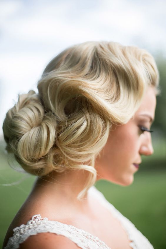 A classic bridal hair look mimicking old Hollywood glamor. Hair is waved and pinned into a bun. Discover how Vênsette can craft custom beauty looks for your special moment: http://vensette.com/bridal_inquiries: 